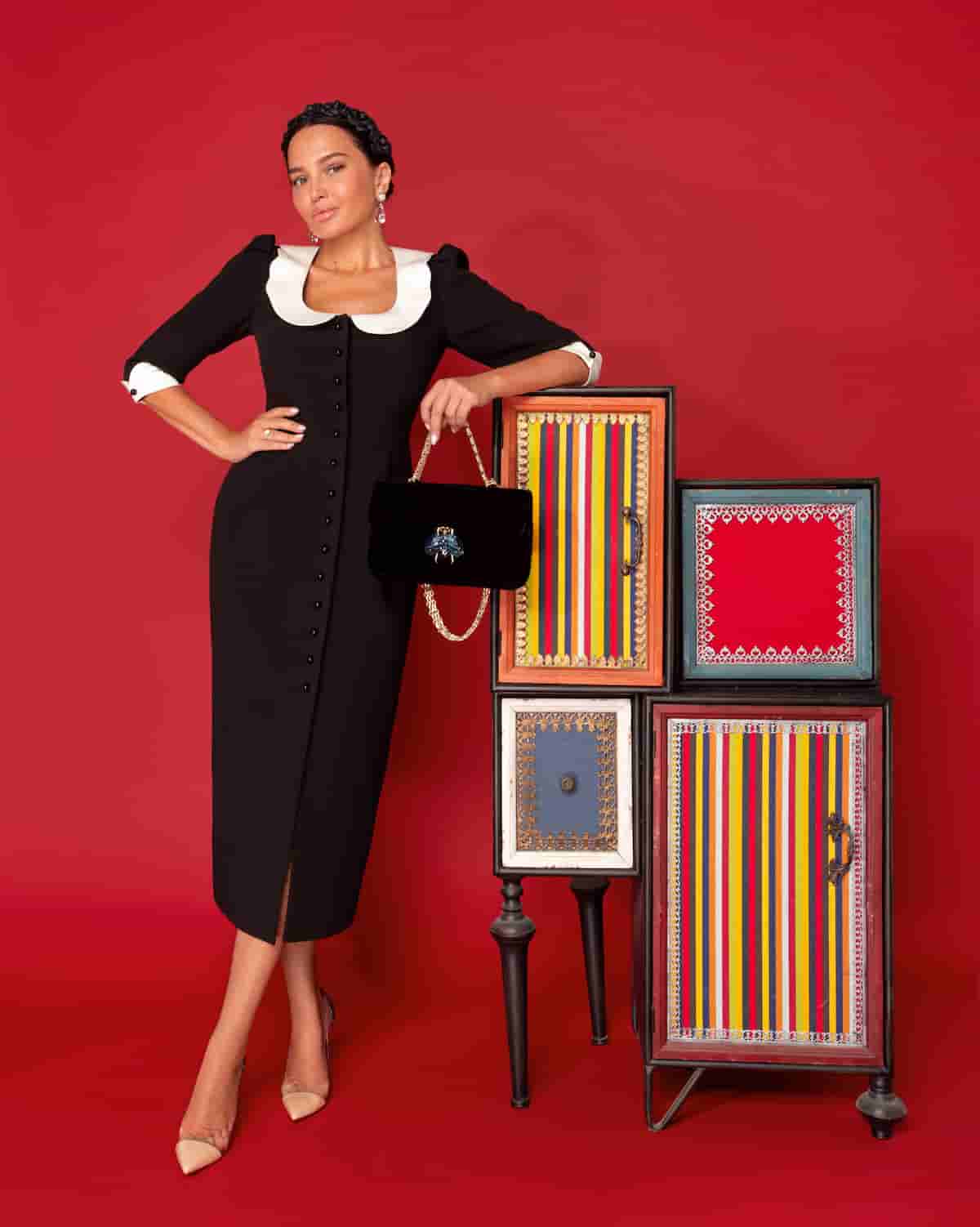 Black sheath dress with white collar and cuffs