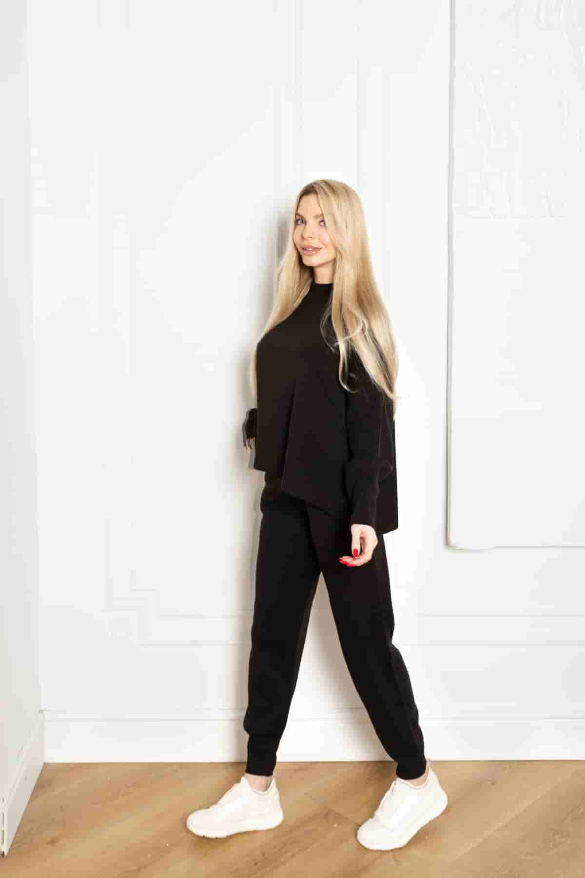 Knitted black suit with tapered trousers