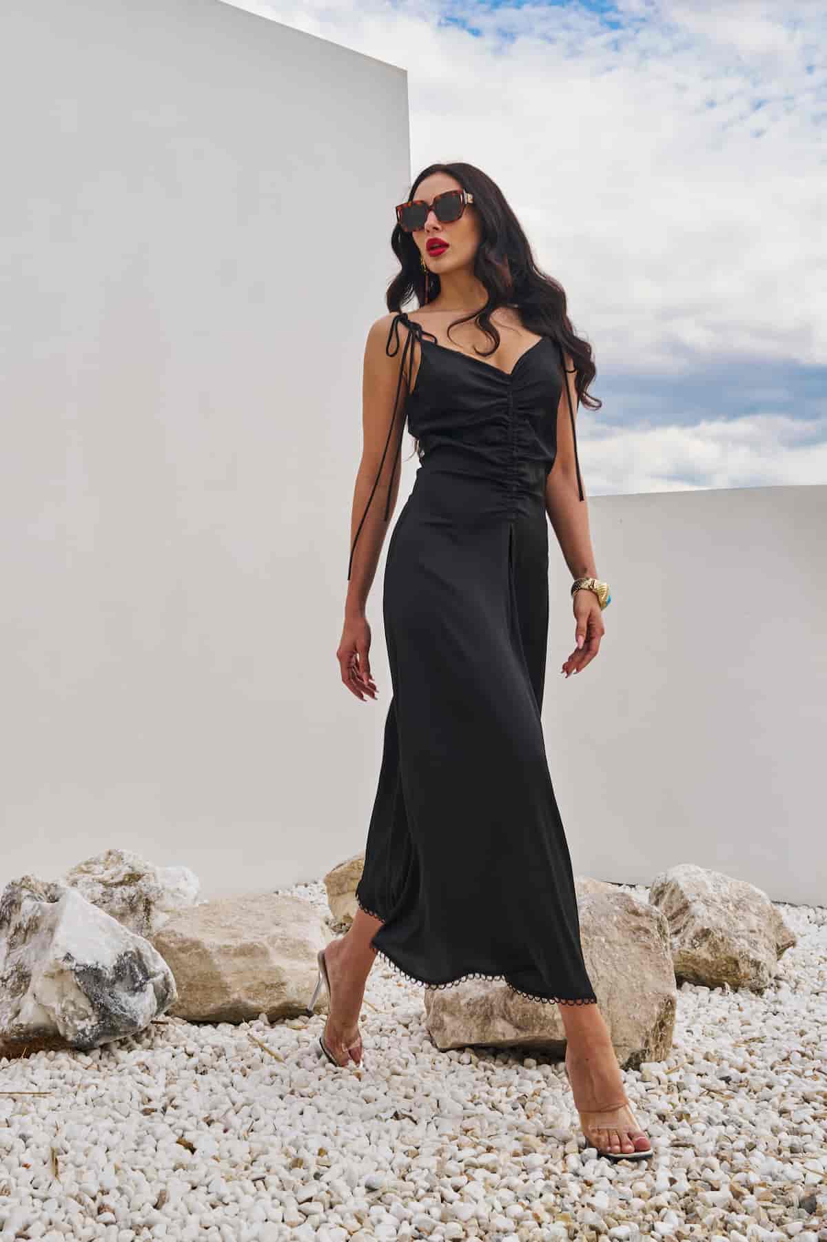 Black combination dress with draped chest and open back