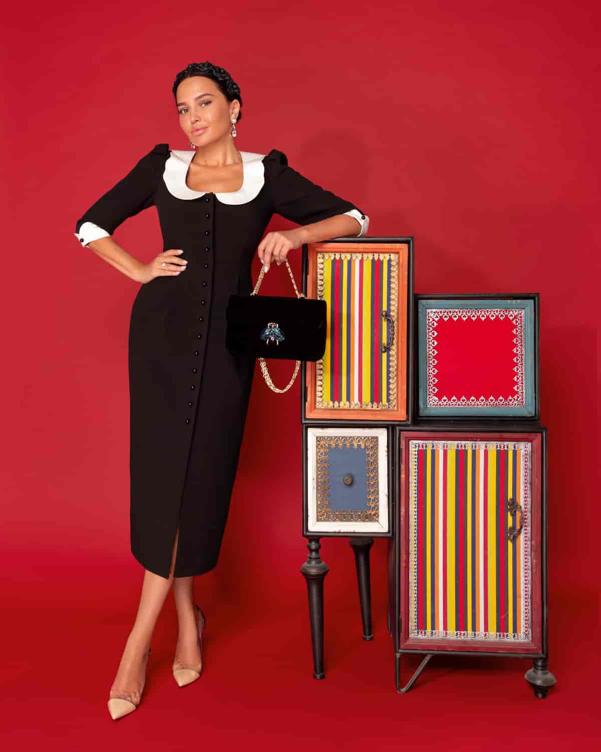 Black sheath dress with white collar and cuffs