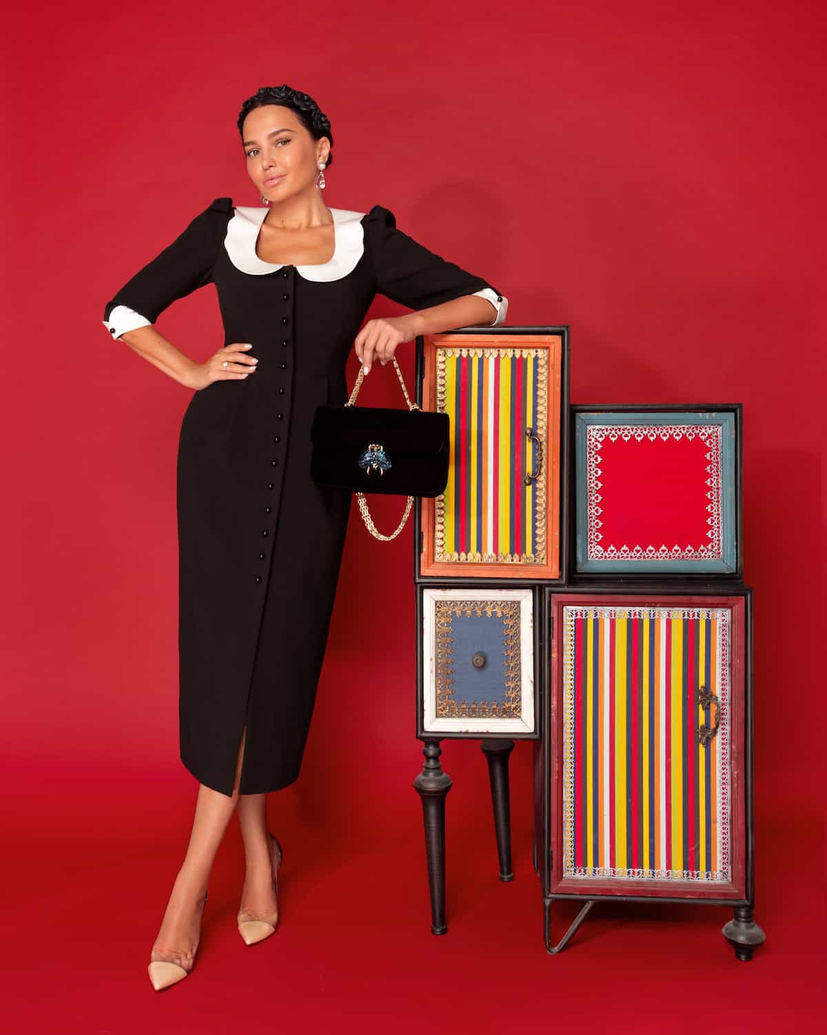 Black sheath dress with white collar and cuffs