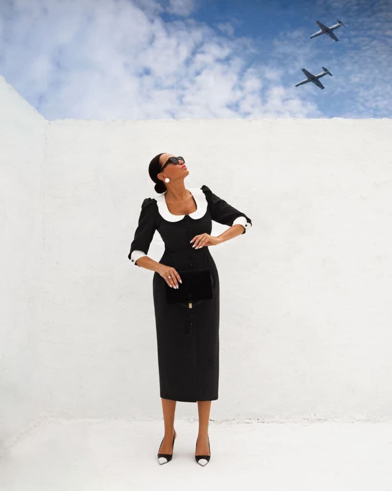 Black sheath dress with white collar and cuffs