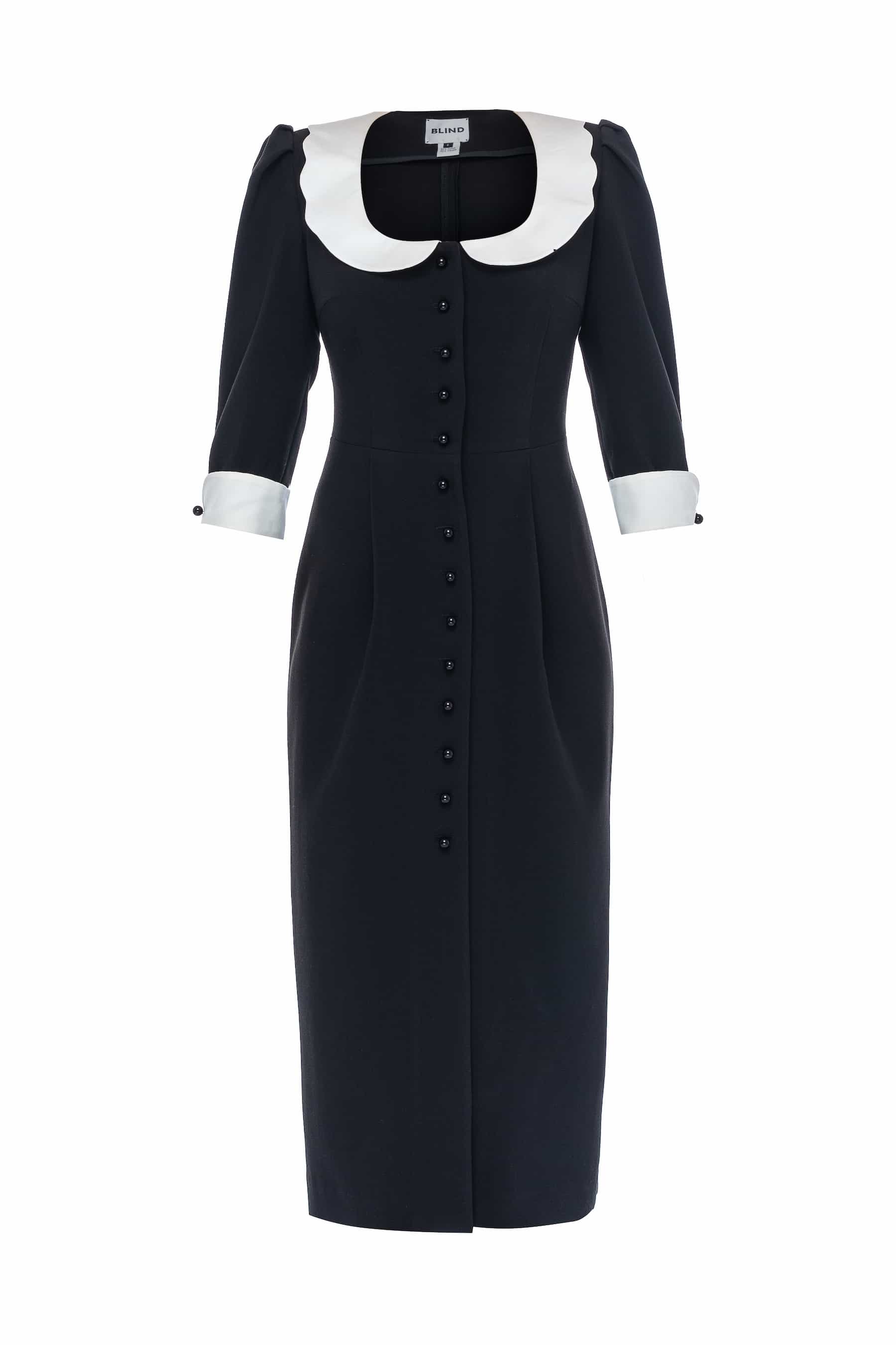 Black sheath dress with white collar and cuffs