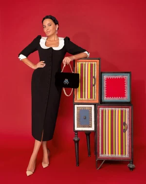 Black sheath dress with white collar and cuffs