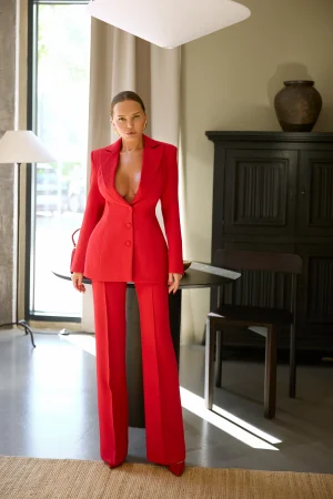 Red suit featuring a fitted blazer and classic straight-leg trousers